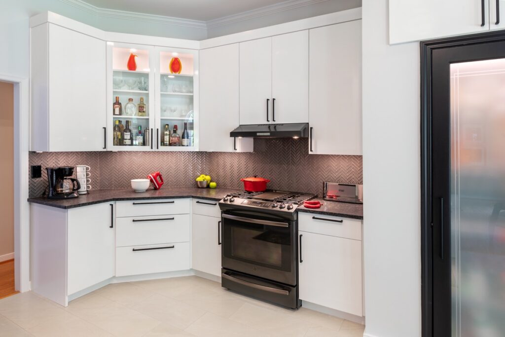 Custom painted David Bradley cabinetry with a durable high-gloss finish paired with velvety matte countertops in a functional kitchen remodel.