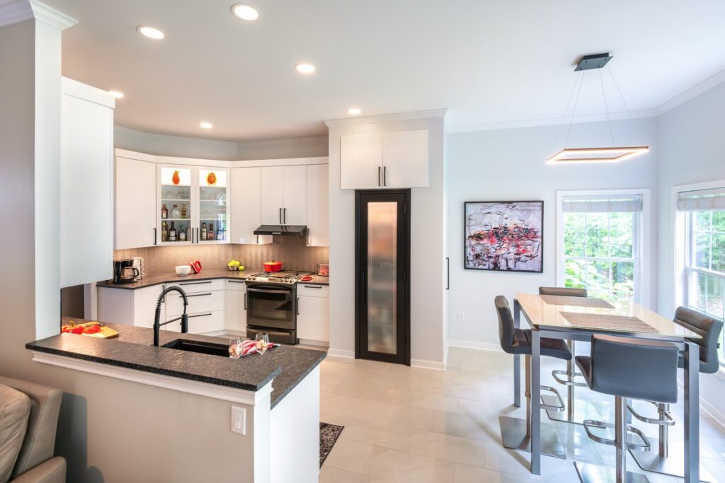 Open-concept kitchen remodel layout displaying optimized storage, an integrated dining space, and a seamless transition into the living room.